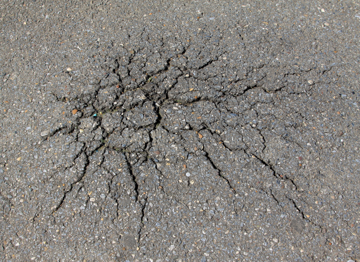 Why Denver’s High-Altitude UV Rays Break Down Asphalt Faster — And How Premium Sealcoating Stops It