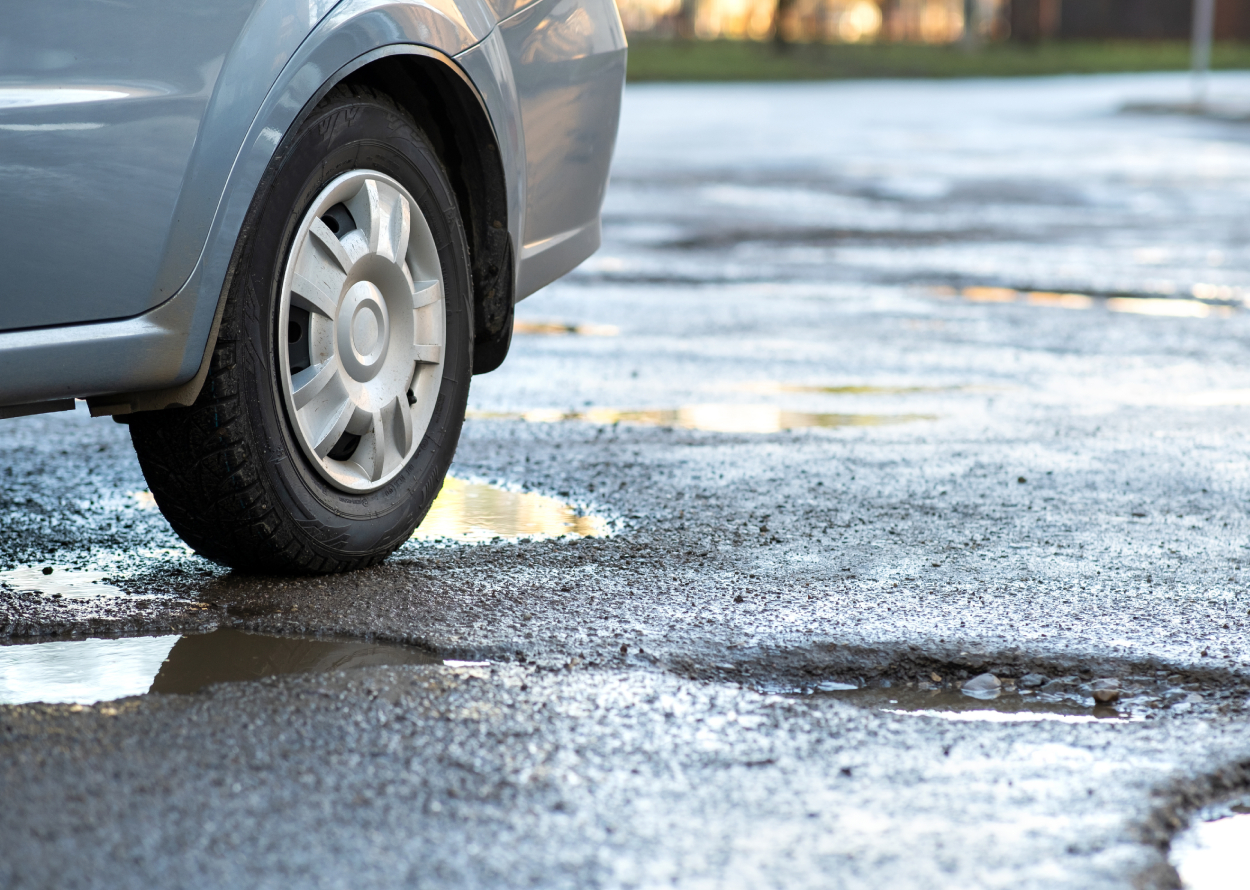 Why Water Pools on Your Asphalt Driveway — And What to Do Before Winter Makes It Worse